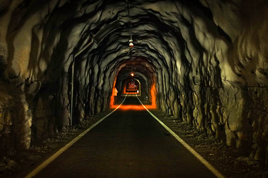 Dark endless tunnel through the mountain, Faroe islands